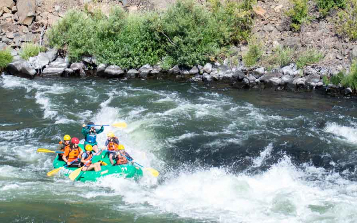 girls navigate rapids on rafting expedition with outward bound